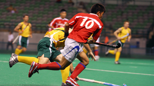 Male hockey players in a match